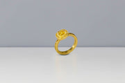 Todd Reed engagement ring in 18 karat yellow gold, set with natural yellow diamond(1.0cts) with raw diamond cubes(.69 cts) and white brilliant cut diamonds(.08cts)
